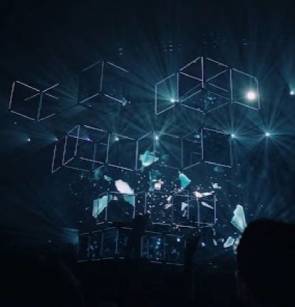 An image of cube puzzle in very large size one over the other with light flashing behind the cubes.